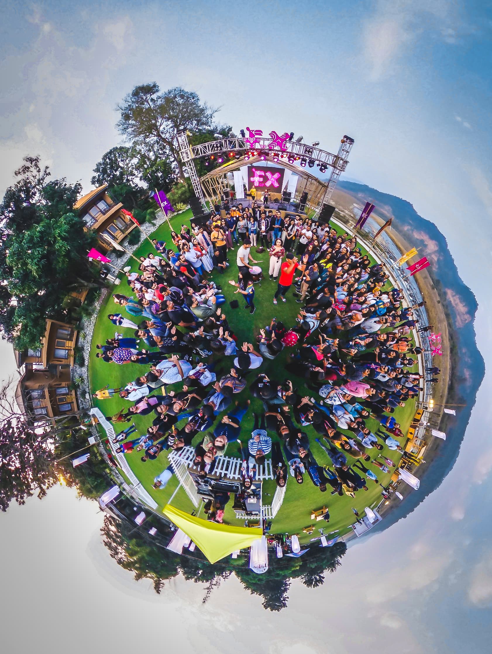 A crowd gathered around a performance at the F of X forest festival.