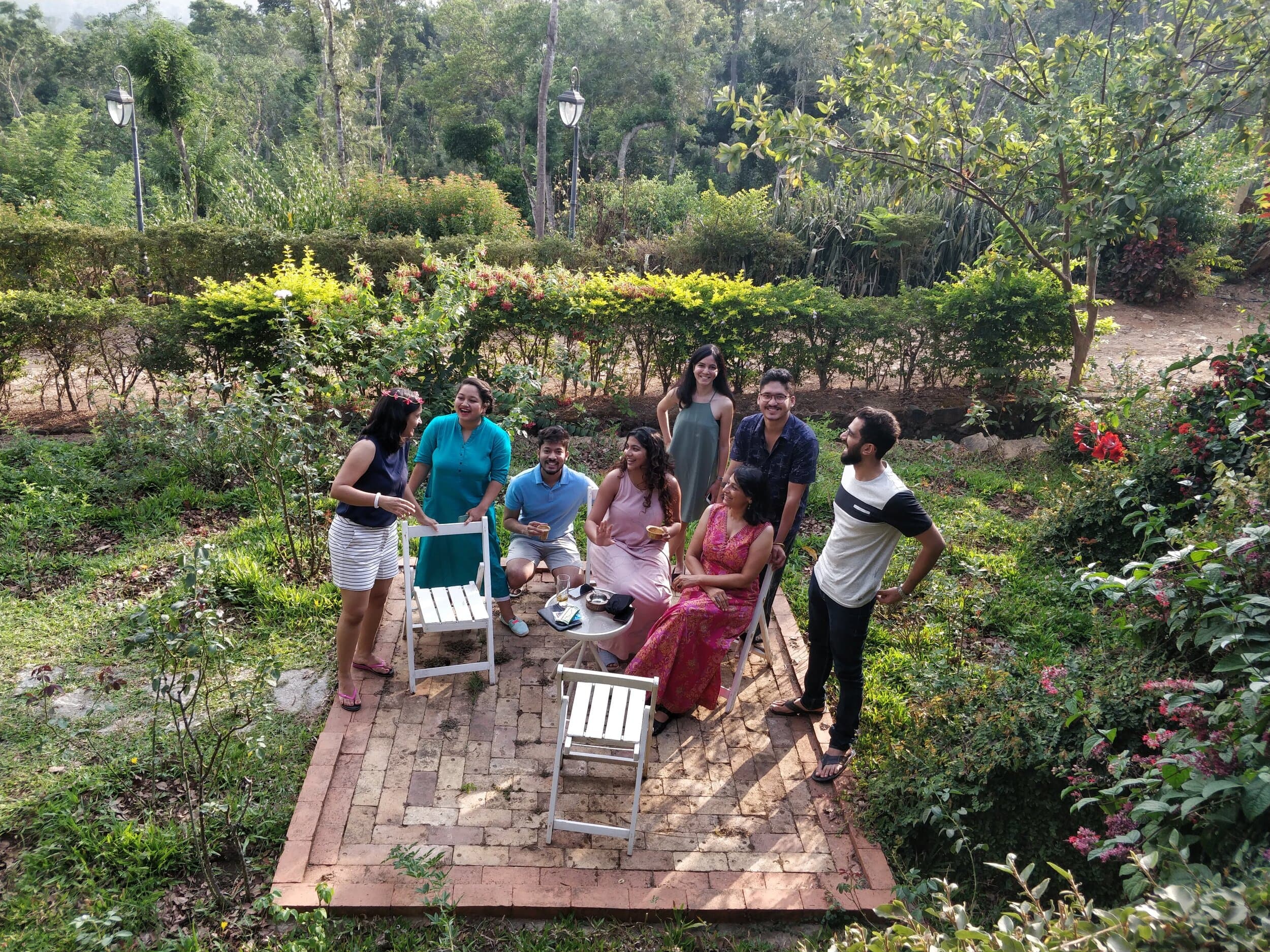 Story Collective participants talking together in a garden.